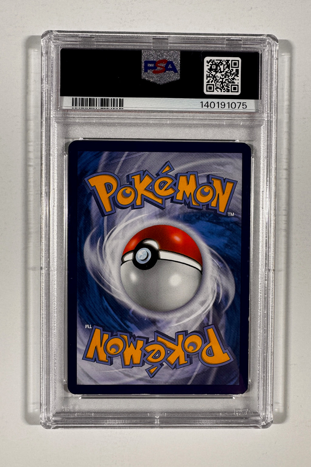 Back of PSA graded slab displaying Pokemon card back and PSA certification QR code.