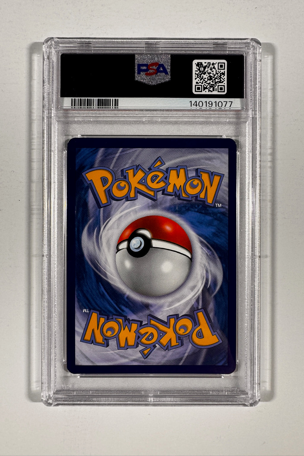 Back of PSA graded slab displaying Pokemon card back and PSA certification QR code.