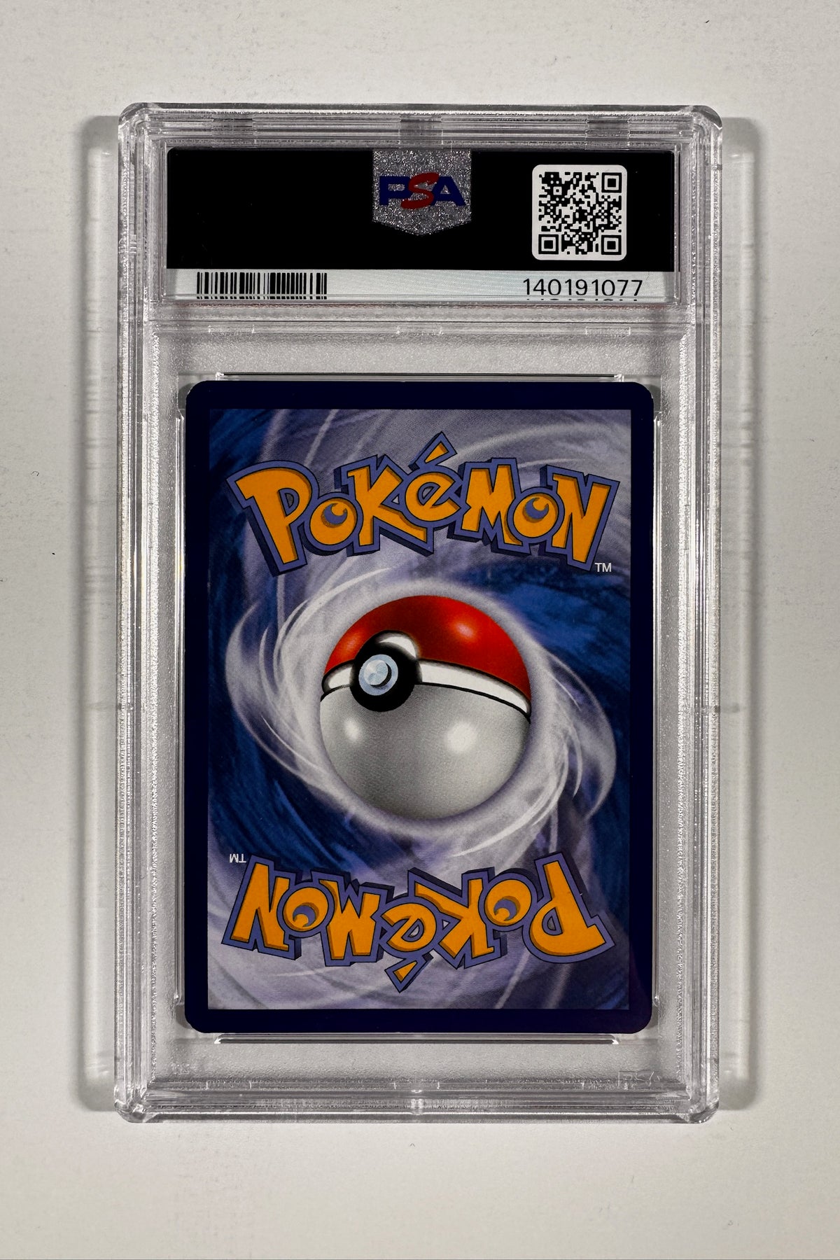 Back of PSA graded slab displaying Pokemon card back and PSA certification QR code.