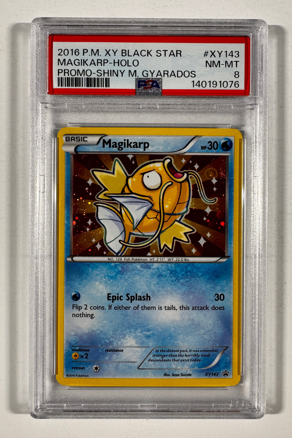 A graded holographic Pokémon TCG card, specifically a 2016 P.M.