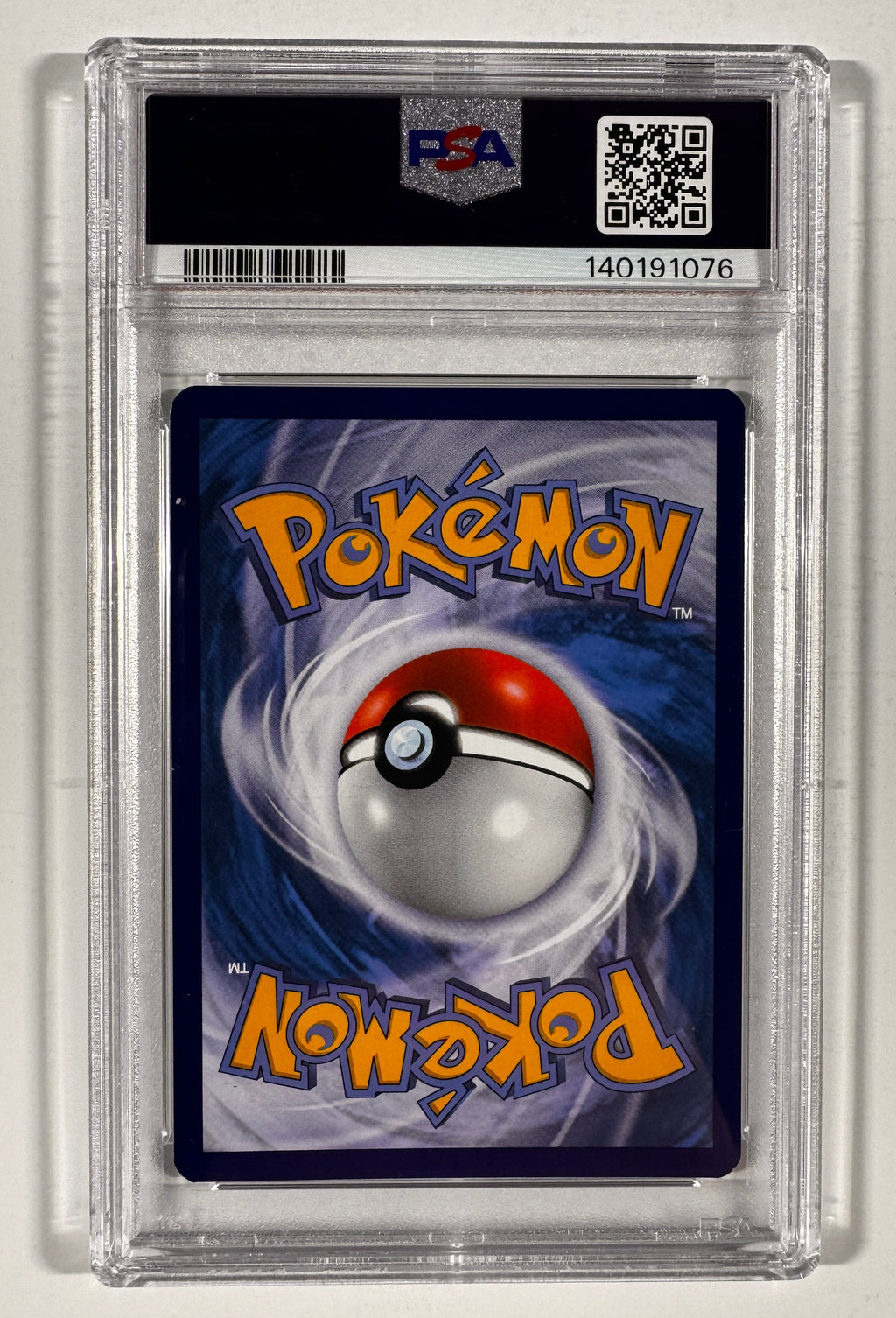 A graded Pokémon trading card in a clear PSA plastic holder, showing the card back with the Pokémon logo and a red-and-white ball graphic on a blue background.