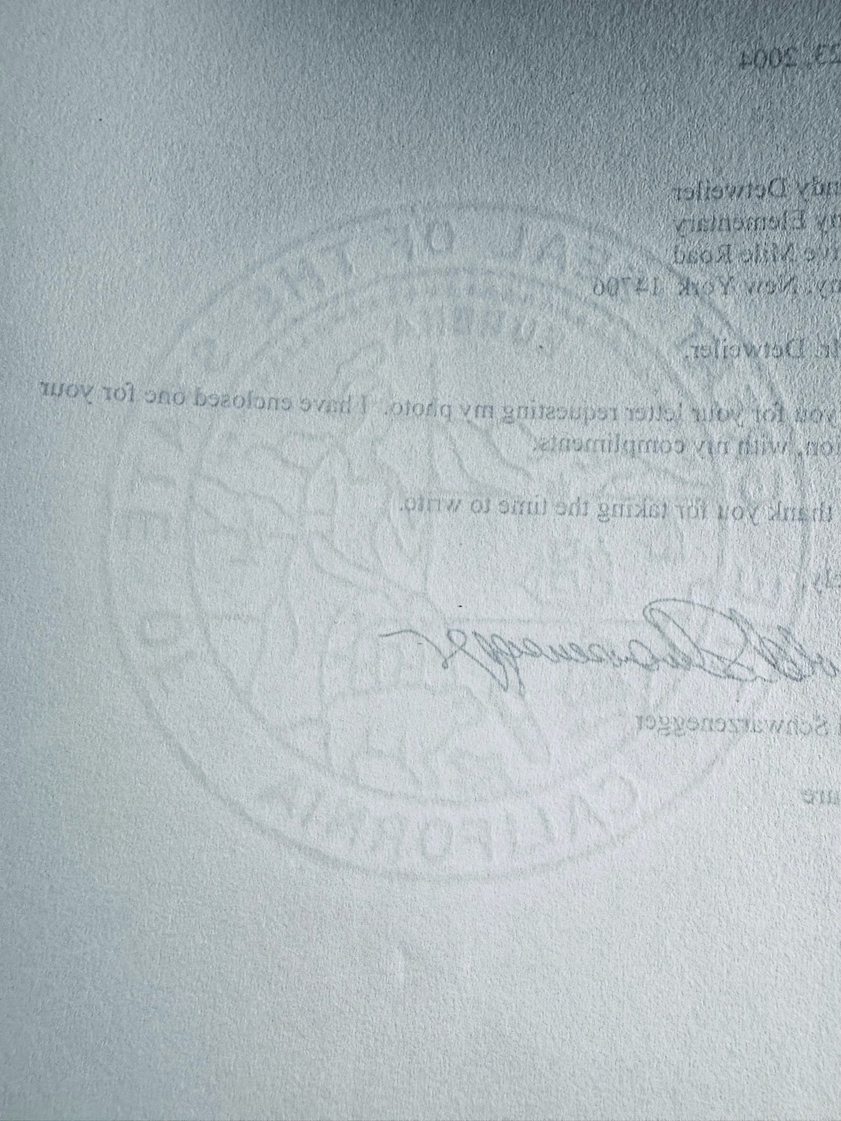 Detailed view of The Great Seal of the State of California paper watermark on official correspondence.