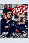 A comic-style montage poster of Scarface featuring Al Pacino as Tony Montana holding a gun with blood-splattered hands and details, signed with a marker signature in the center.