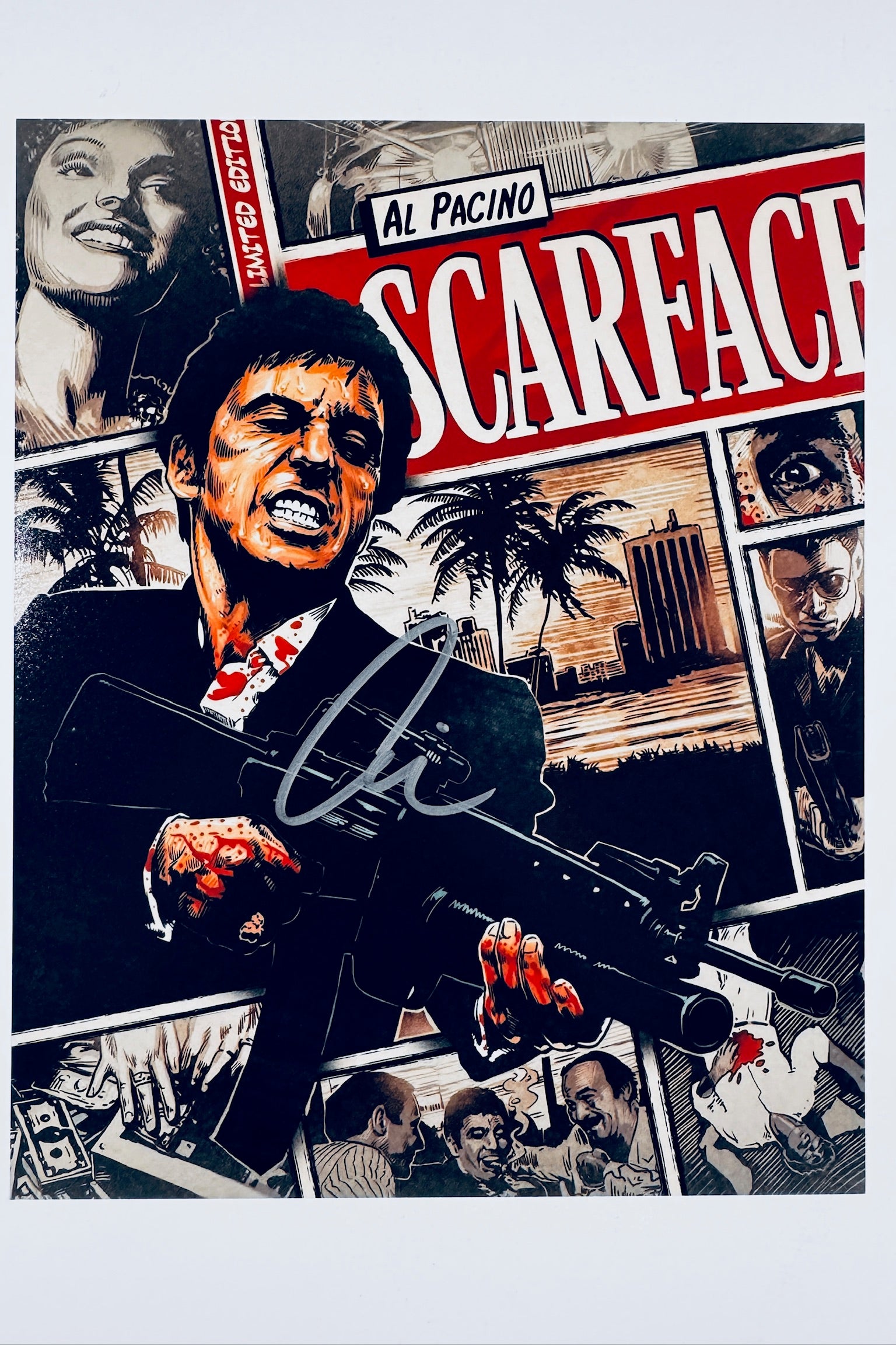 A comic-style montage poster of Scarface featuring Al Pacino as Tony Montana holding a gun with blood-splattered hands and details, signed with a marker signature in the center.