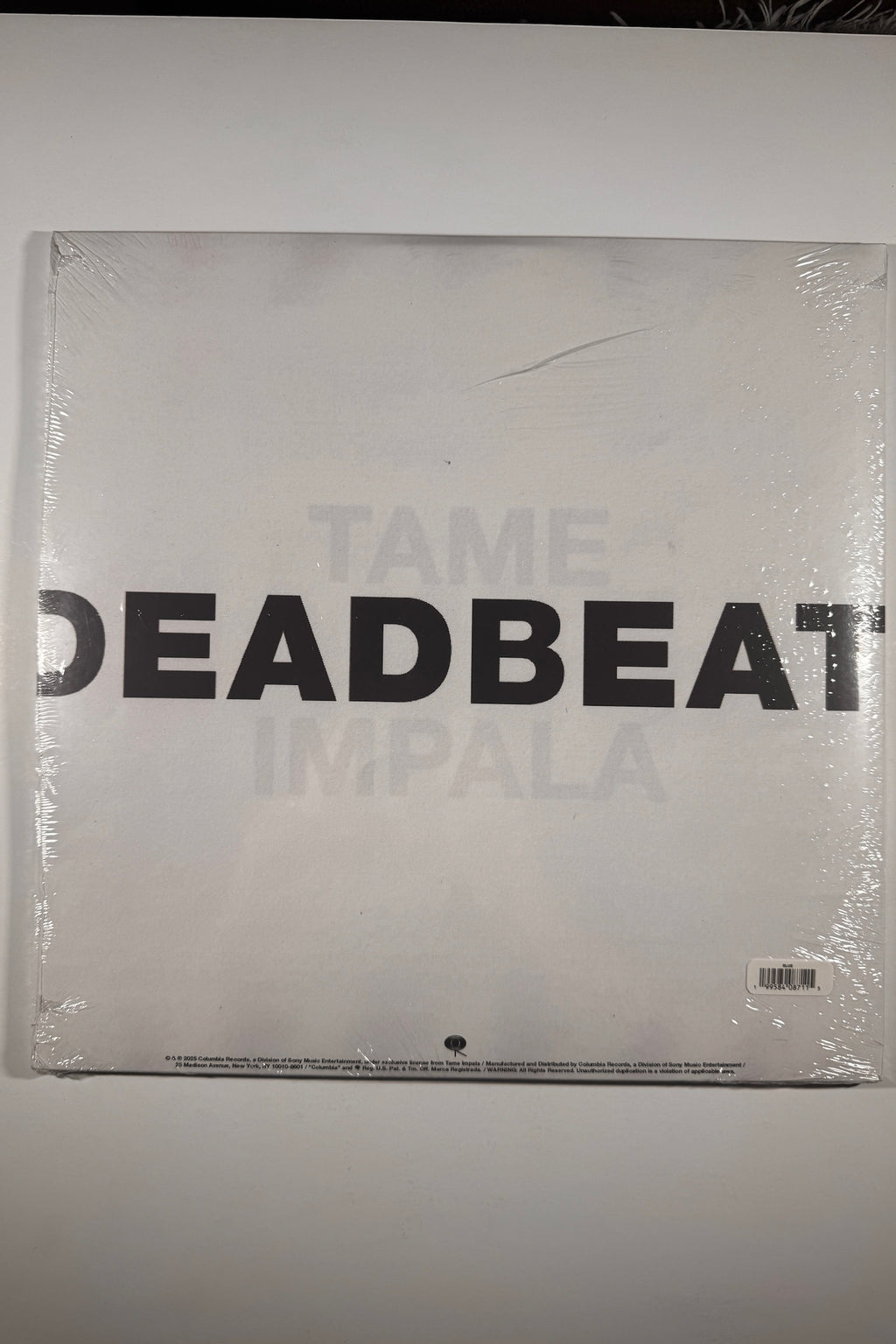 Back jacket of the sealed Tame Impala Deadbeat vinyl LP in original shrink wrap.
