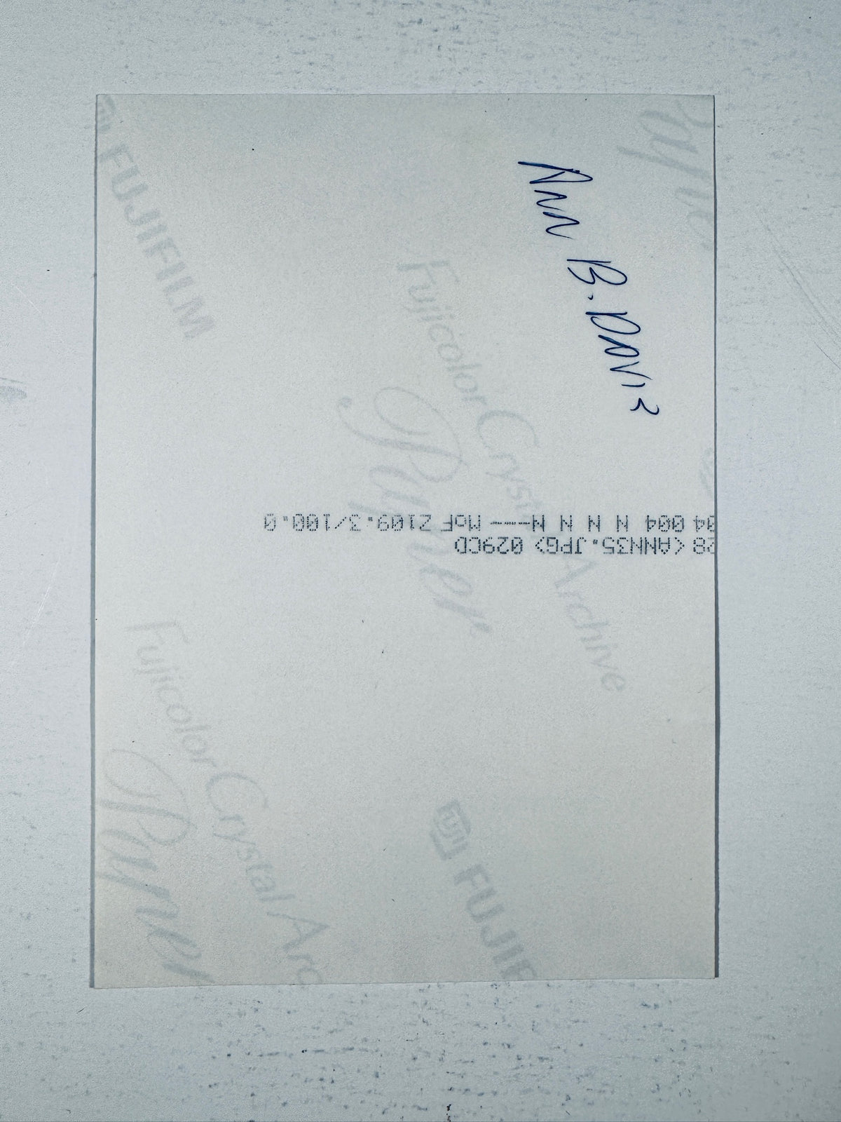 Back of the authentic photo printed on Fujicolor Crystal Archive Paper showing handwritten text and paper details.