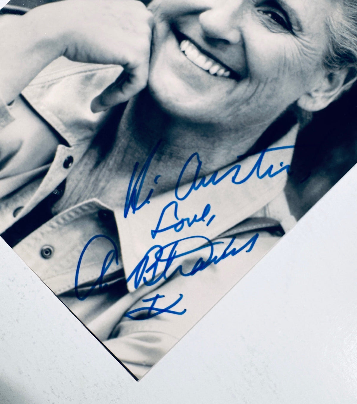 Close-up view of the blue ink personalized signature and inscription on an authentic Ann B. Davis signed photo.