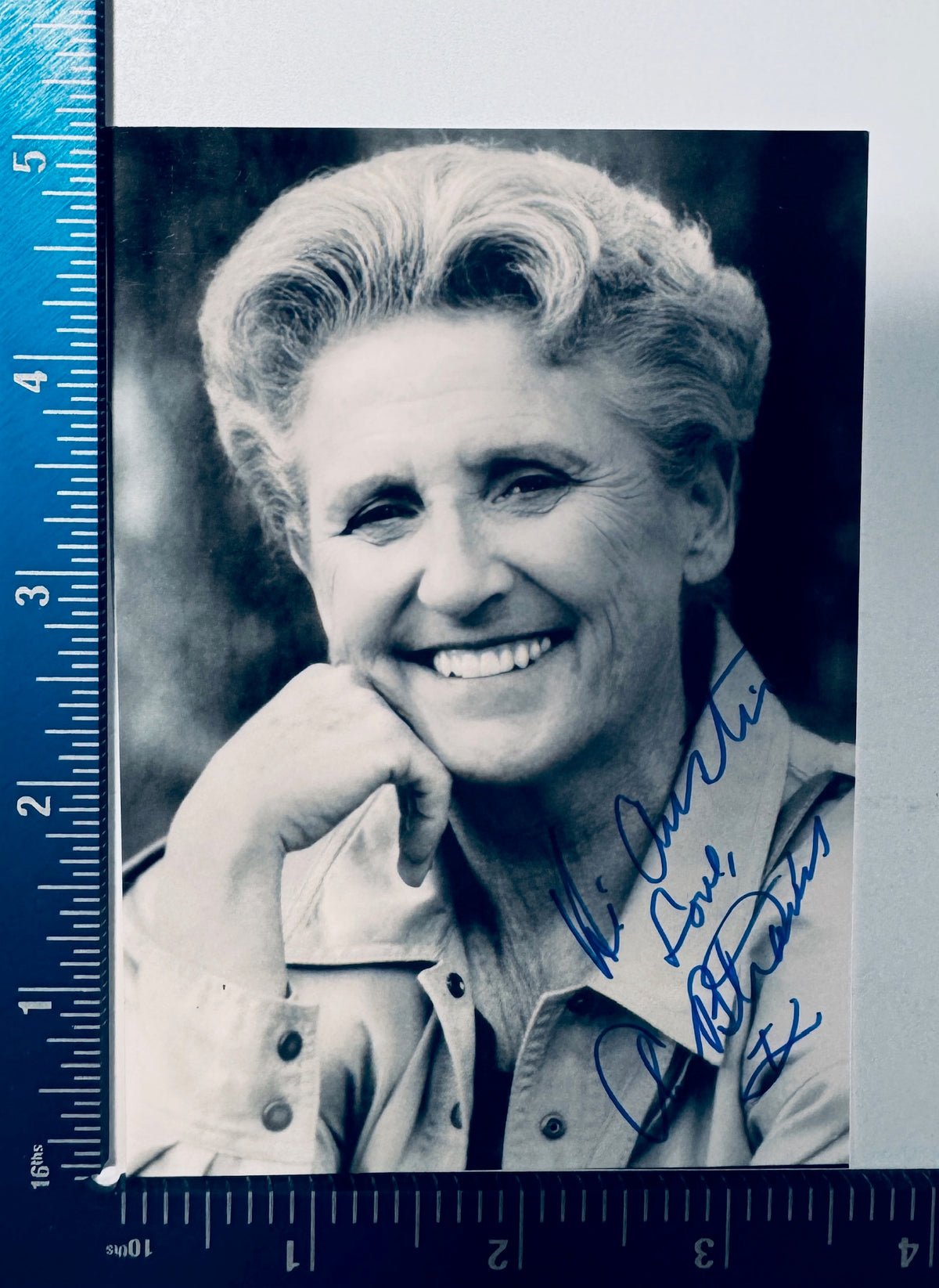 Autographed Ann B. Davis photo shown next to a measuring ruler to display physical dimensions.