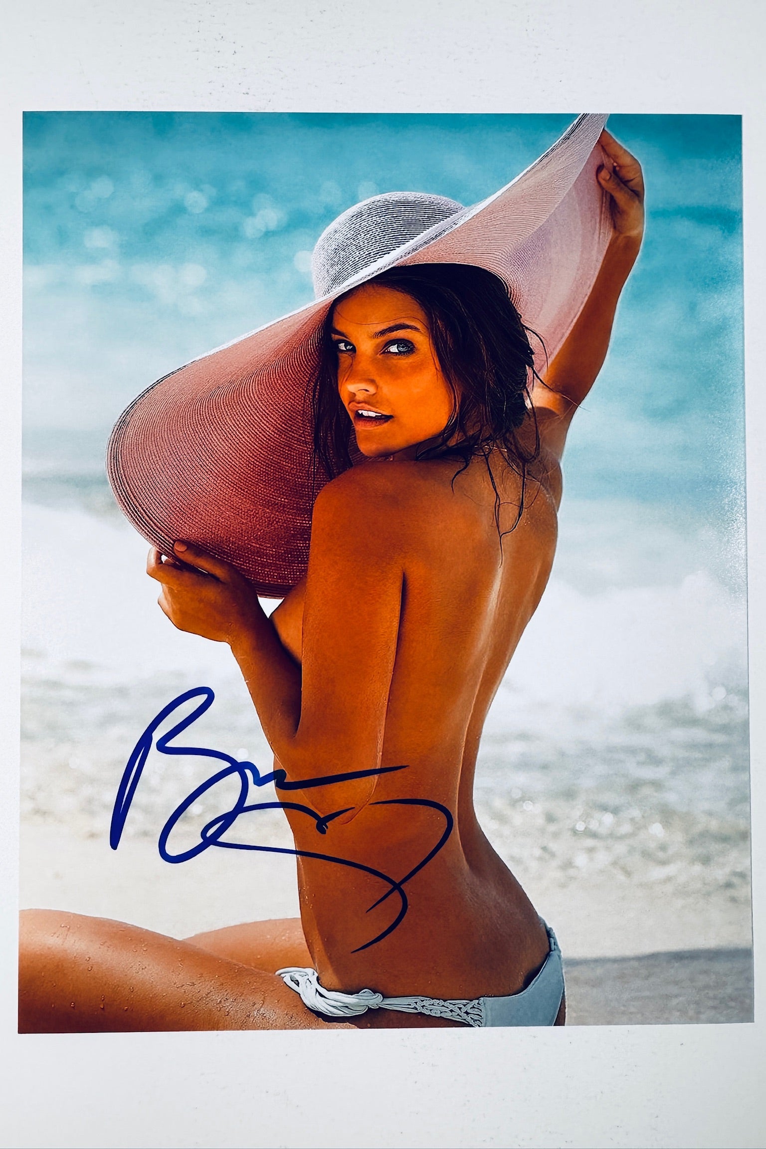 Barbara Palvin hand-signed 8x10 matte photo wearing a wide-brim sunhat and bikini on a sunny beach.