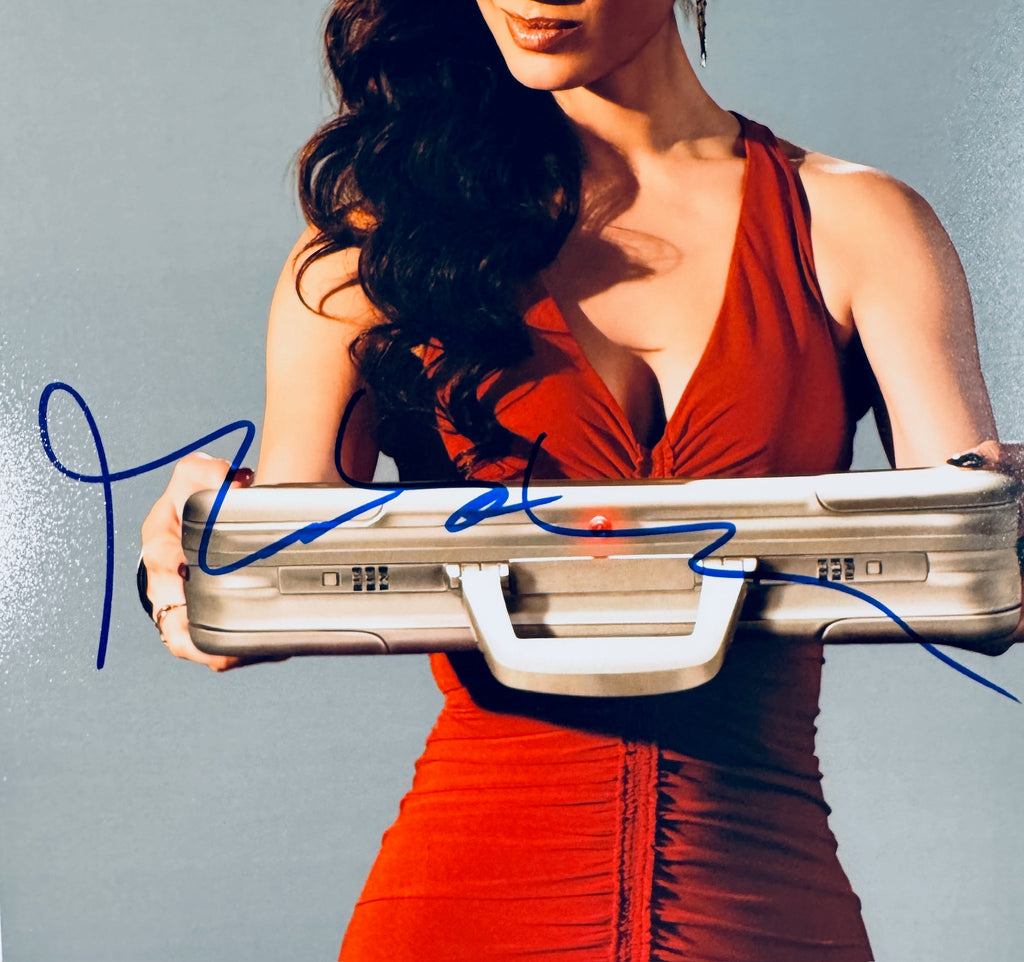Close-up view of the blue autograph of Bernice Marlohe, the James Bond girl from Skyfall, across the front of the promotional photograph.