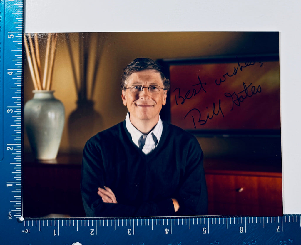 Autographed Bill Gates 5x7 photograph placed next to a L-shaped blue ruler showing exact dimensions.
