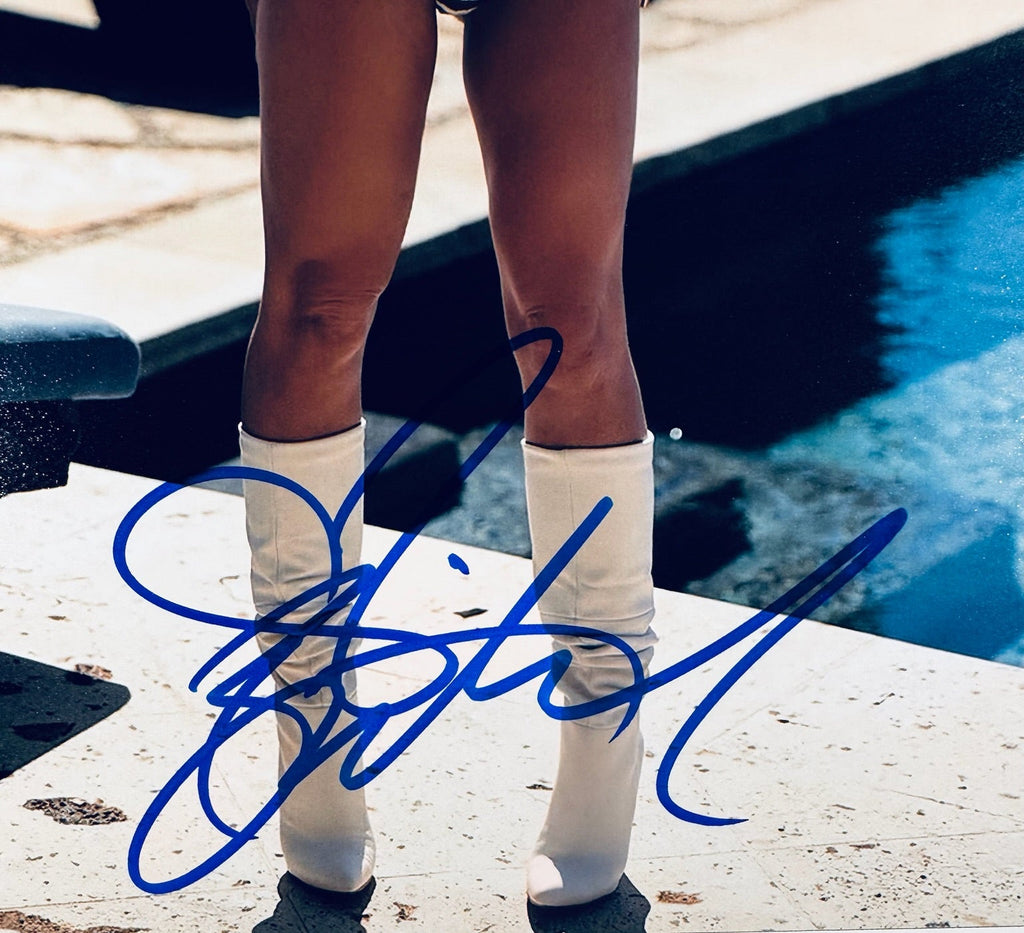 Closeup of Britney Spears autograph on signed 8x10 matte photo