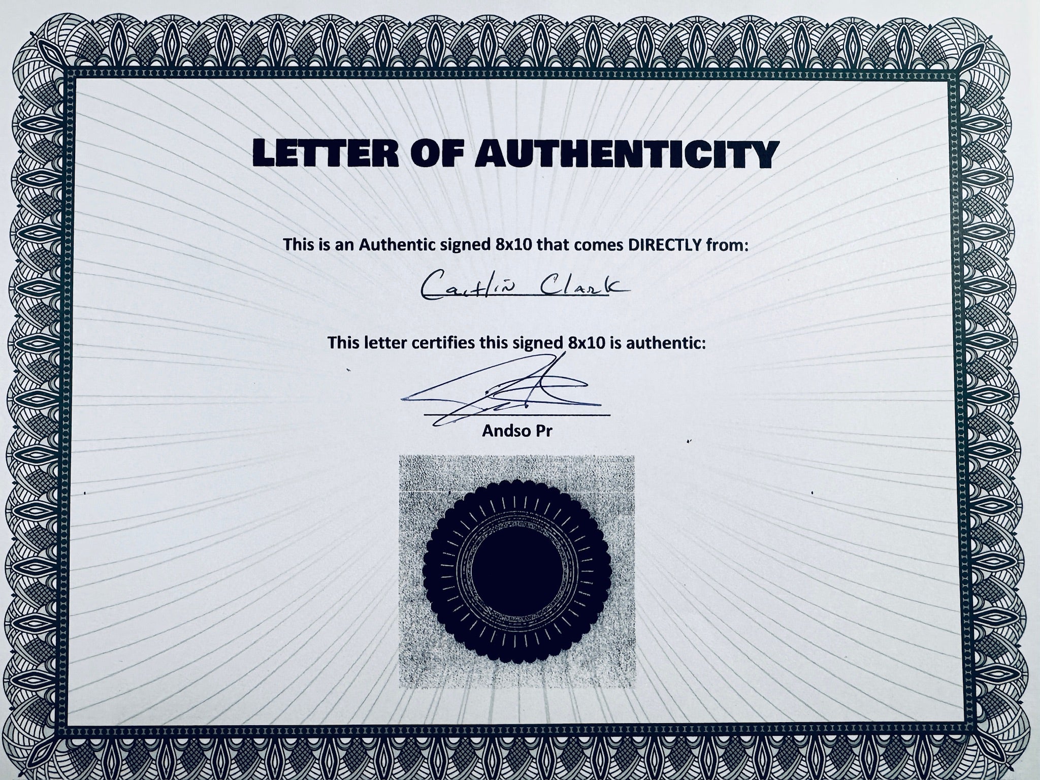 A Letter of Authenticity with a decorative blue-patterned border, certifying an authentic signed 8x10 coming directly from Caitlin Clark, featuring a dark circular seal graphic at the bottom.