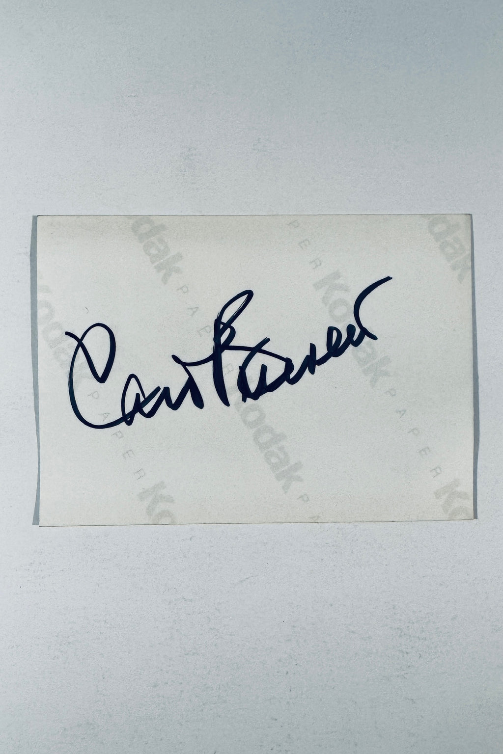 Full back view of vintage photo card featuring Carol Burnett hand signature in black marker on Kodak paper.