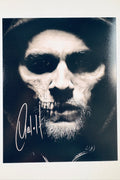 Signed full photo of Charlie Hunnam as Jax Teller from Sons of Anarchy with a skull face makeup effect, featuring a silver autograph.