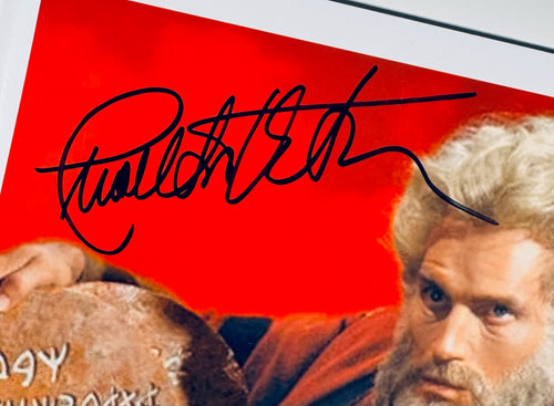 Closeup of Charlton Heston autograph on The Ten Commandments signed 10x8 photo