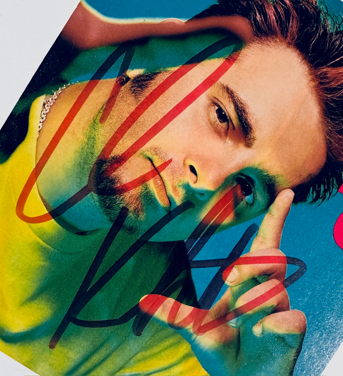 Close-up view of Chris Kirkpatrick autograph signature across his facial portrait.