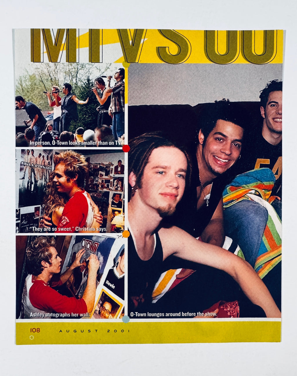 Full back view of magazine page featuring an August 2001 O-Town and MTV article spread.