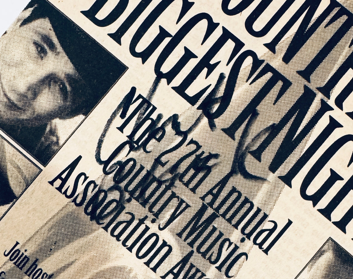 Close-up view of Clint Black signature across the 27th Annual Country Music Association Awards headline.