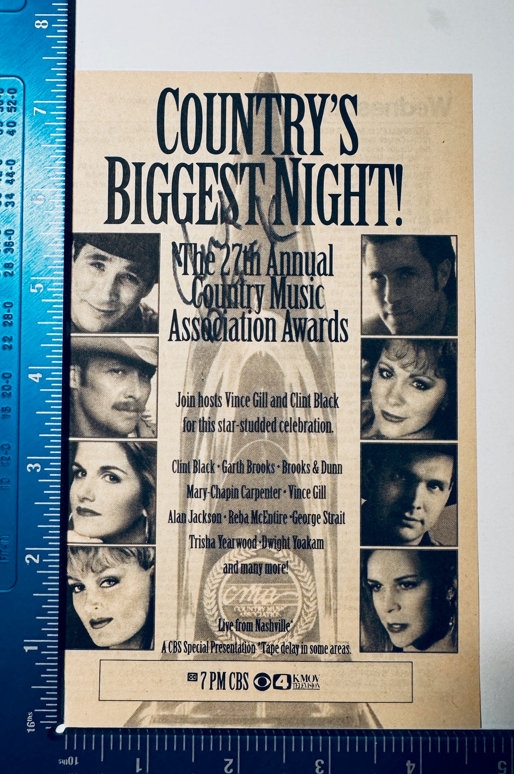 Front view of signed Clint Black CMA Awards clipping with L-shaped ruler showing 3.25x5 inch dimensions.