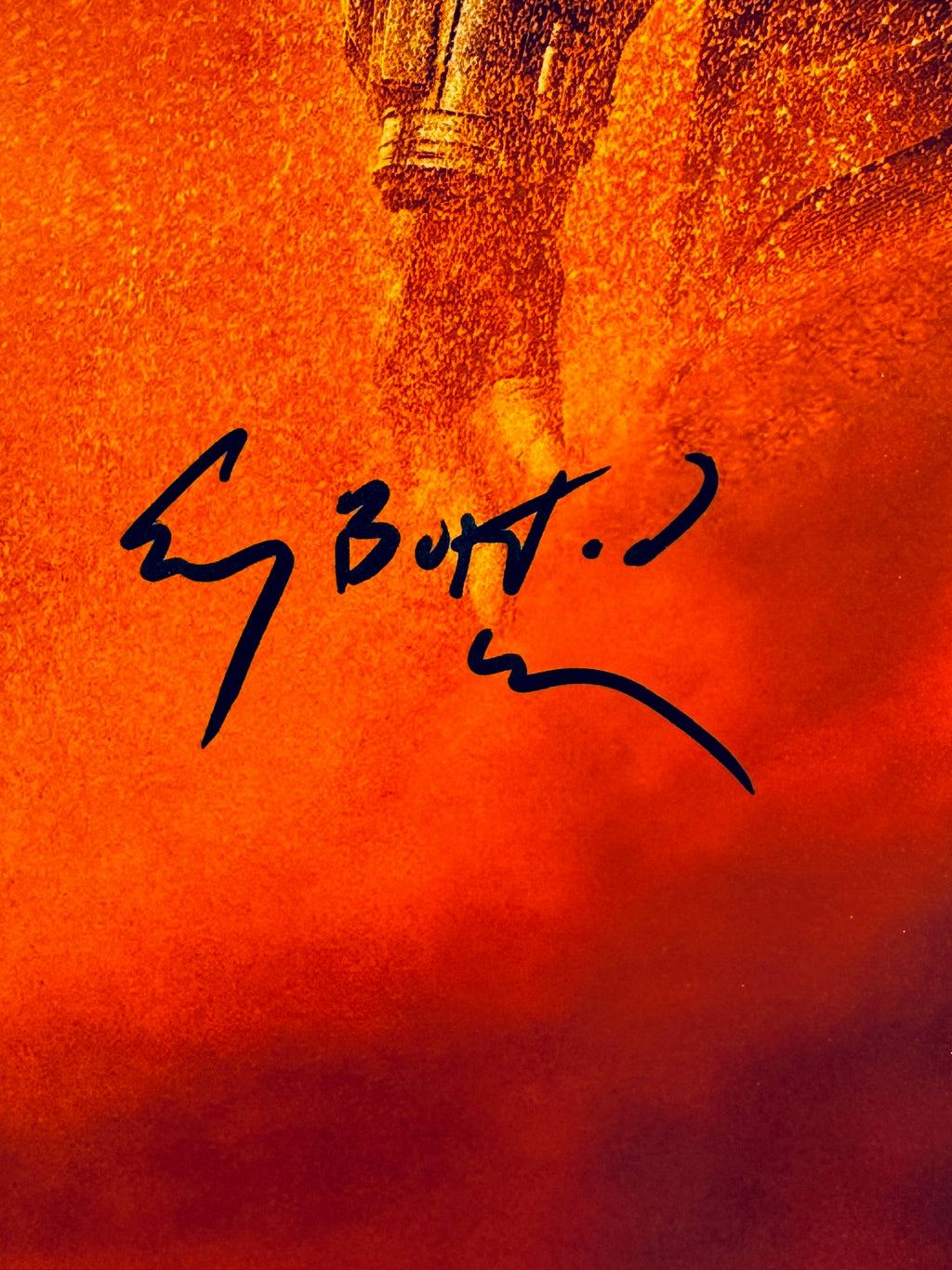 Close-up of Corey Burton's signature in black marker on the Cad Bane signed 8x10 photo.