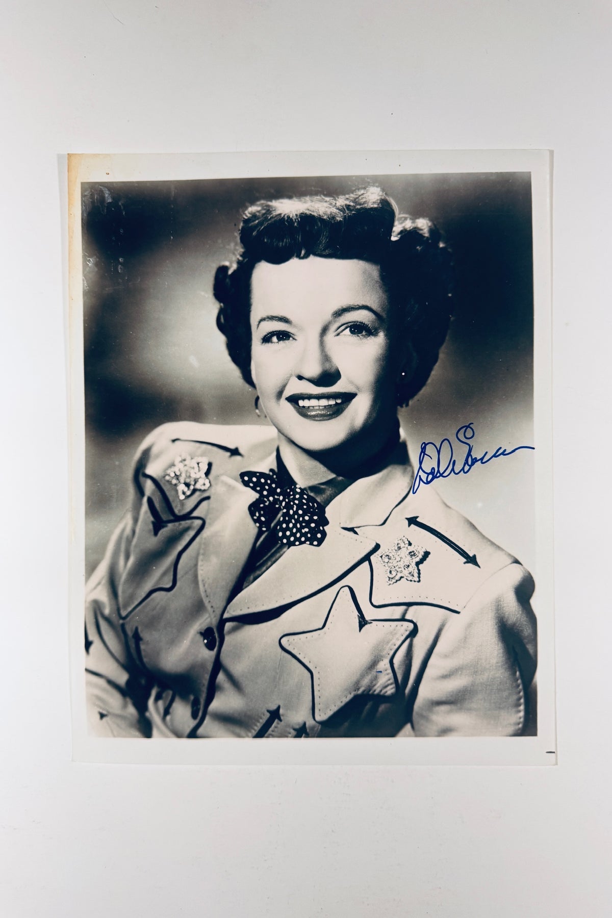 Autographed 8x10 black and white portrait photo of Dale Evans in an embroidered Western jacket signed in blue ink.
