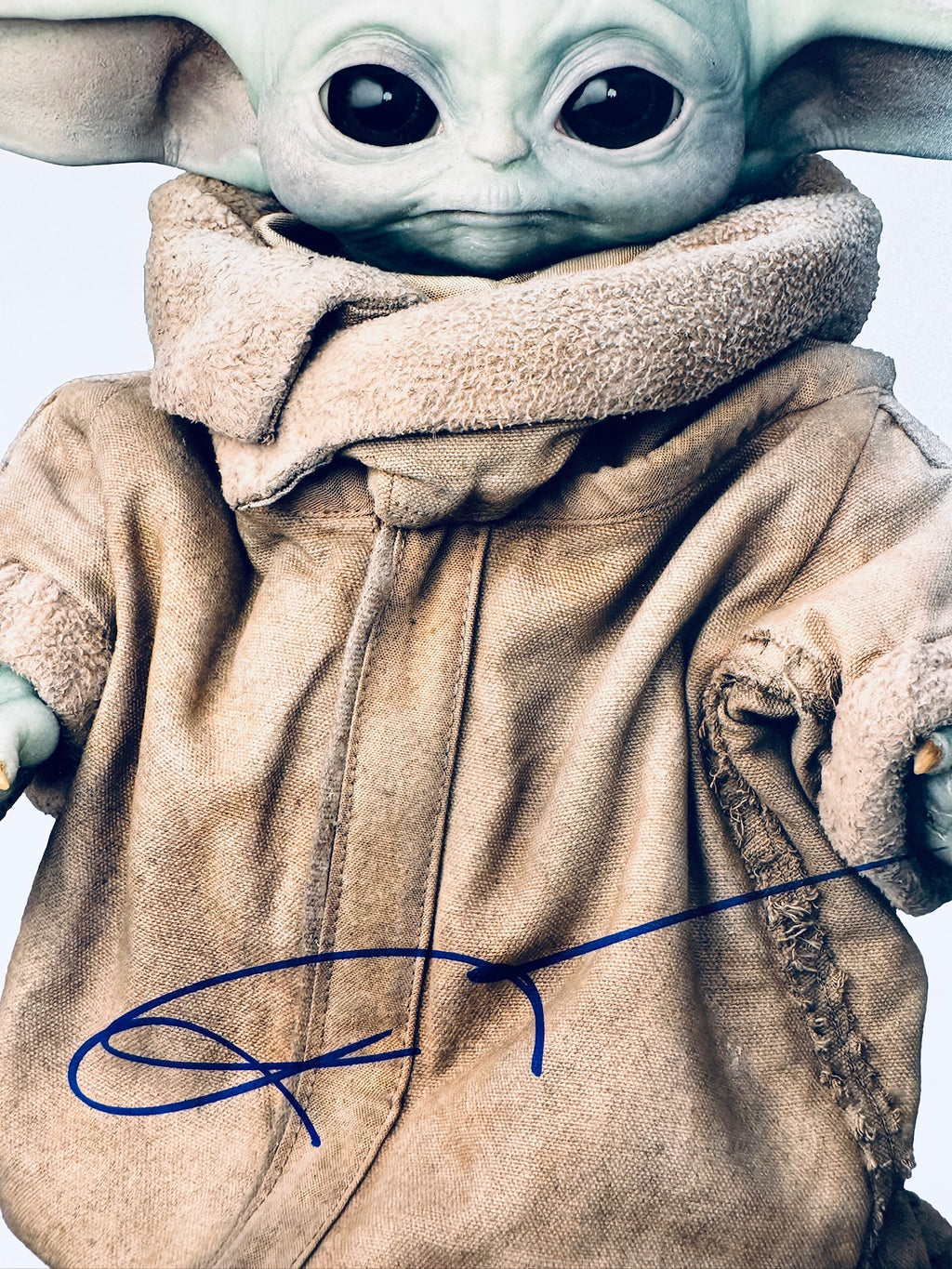 Close-up view of David Acord's signature and voice actor inscription on the Grogu promotional matte photo.