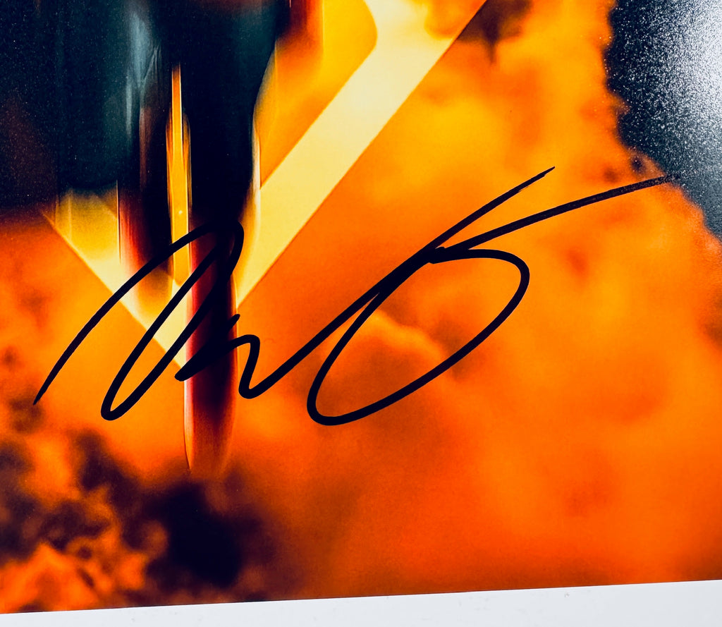 Close-up of David Corenswet's signature in black marker on the signed Superman 8x10 photo.