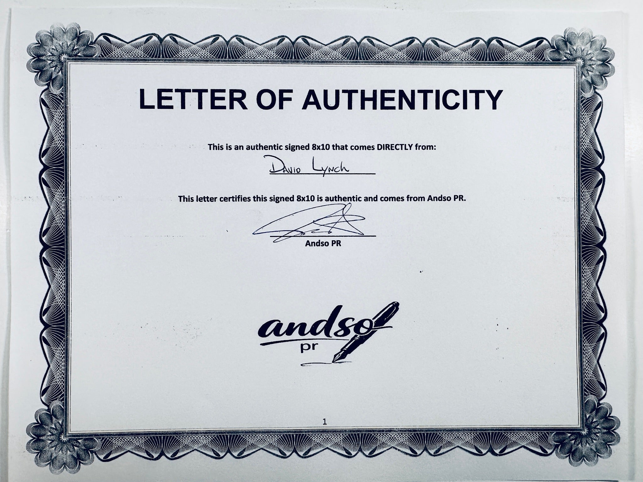 A Letter of Authenticity with a decorative blue-patterned border, certifying an authentic signed 8x10 coming directly from David Lynch, featuring a signature at the top.