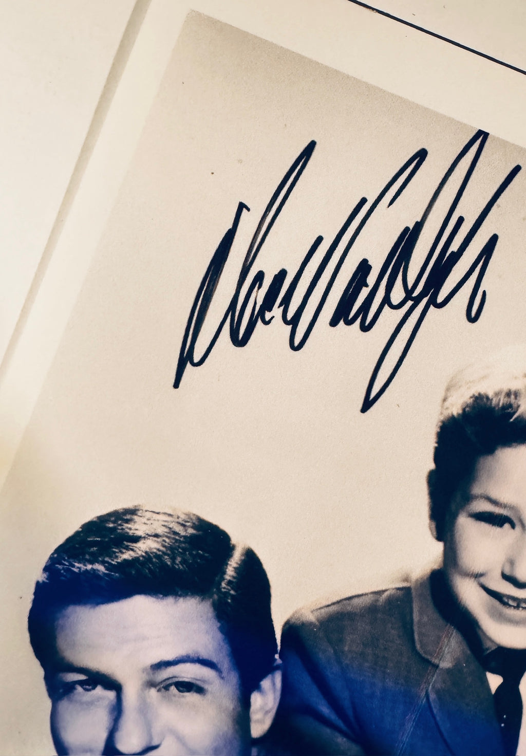 Close-up view of Dick Van Dyke signature in black pen near the top left corner.