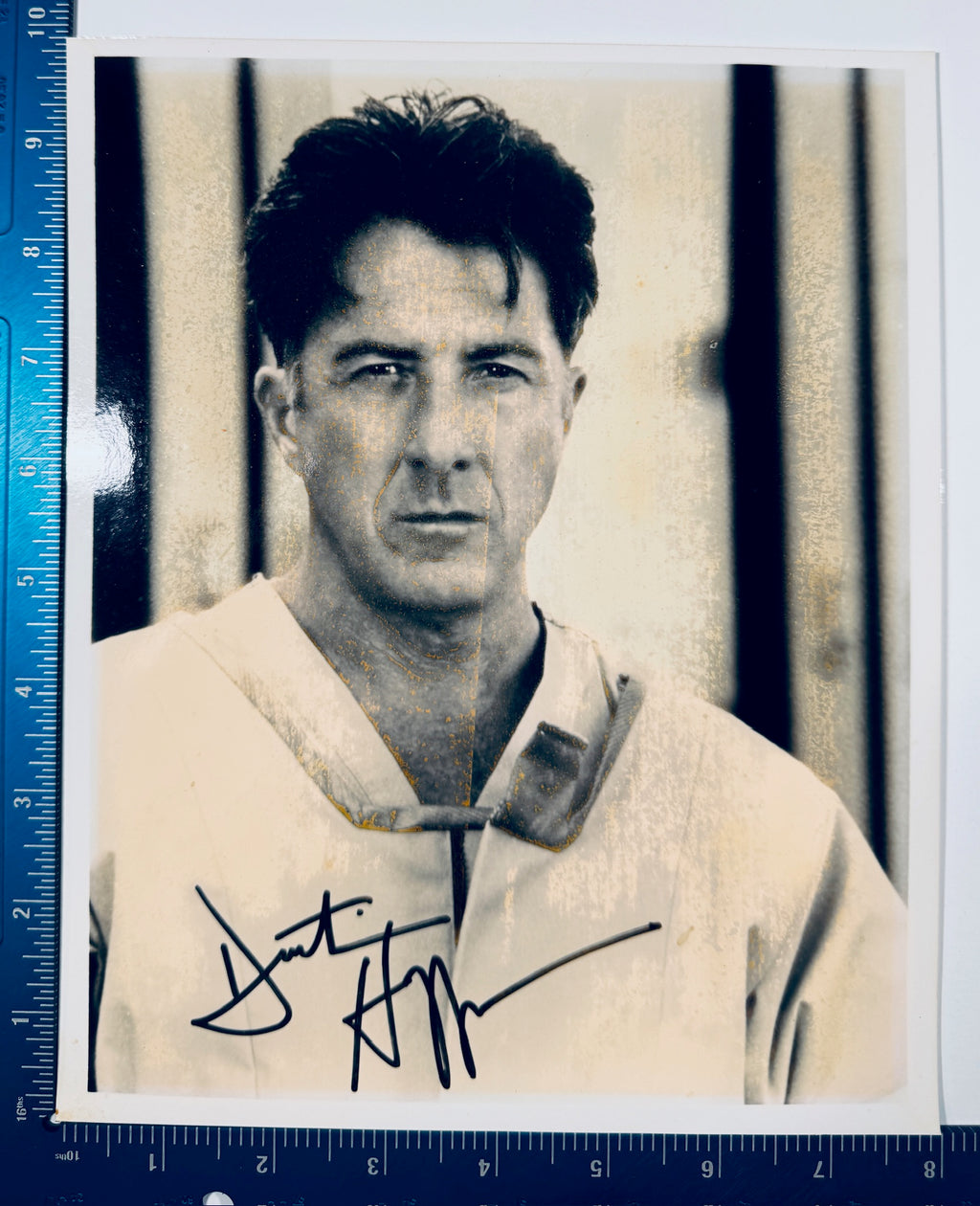 Dustin Hoffman autographed 8x10 portrait photo shown next to a ruler for measurement sizing.