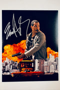 Eddie Murphy hand-signed 8x10 action photo from the movie Metro, holding a gun with a city skyline, explosion background, and red car.