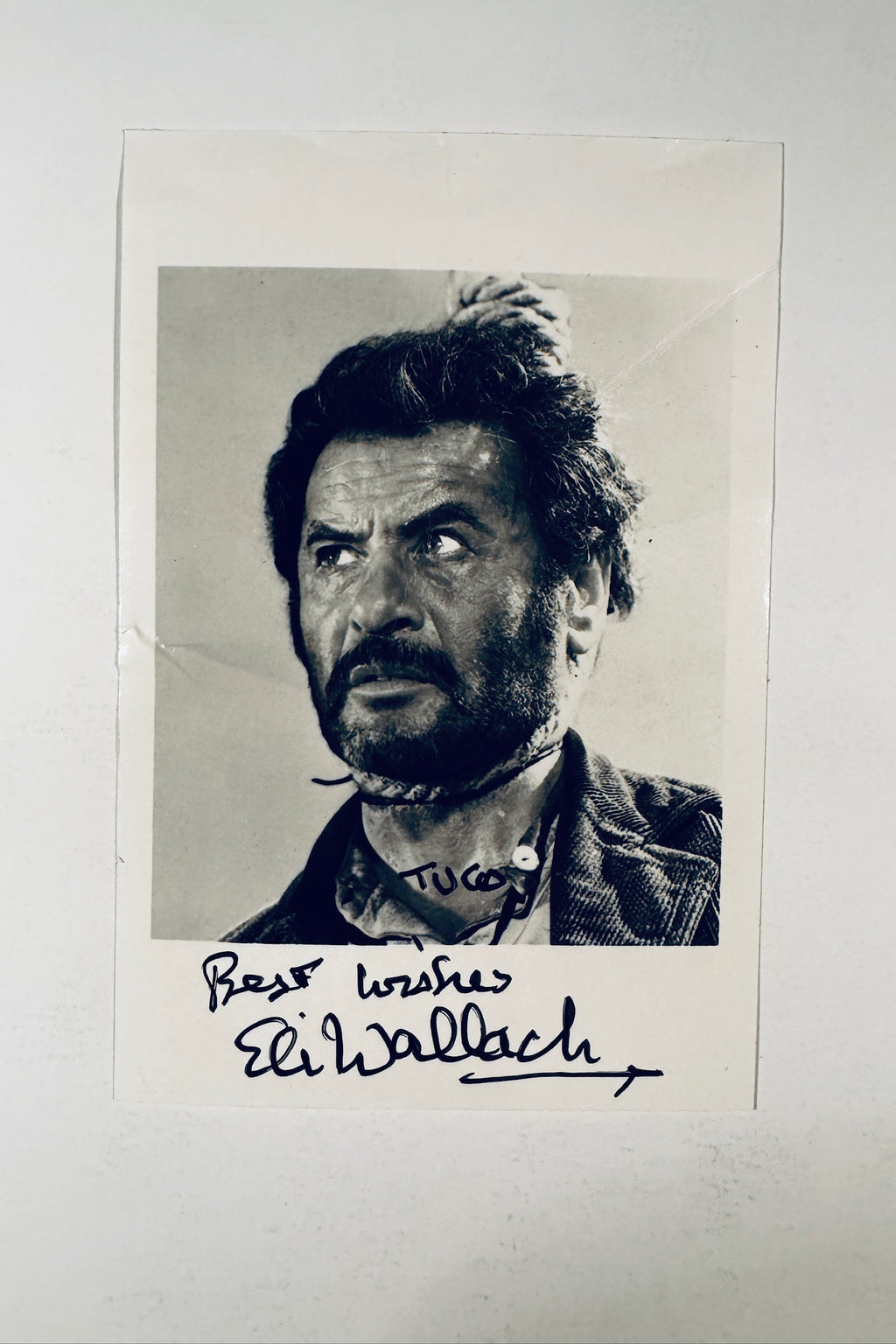 Eli Wallach autographed black and white vintage photo as Tuco in The Good The Bad and The Ugly inscribed Best Wishes and signed Tuco.
