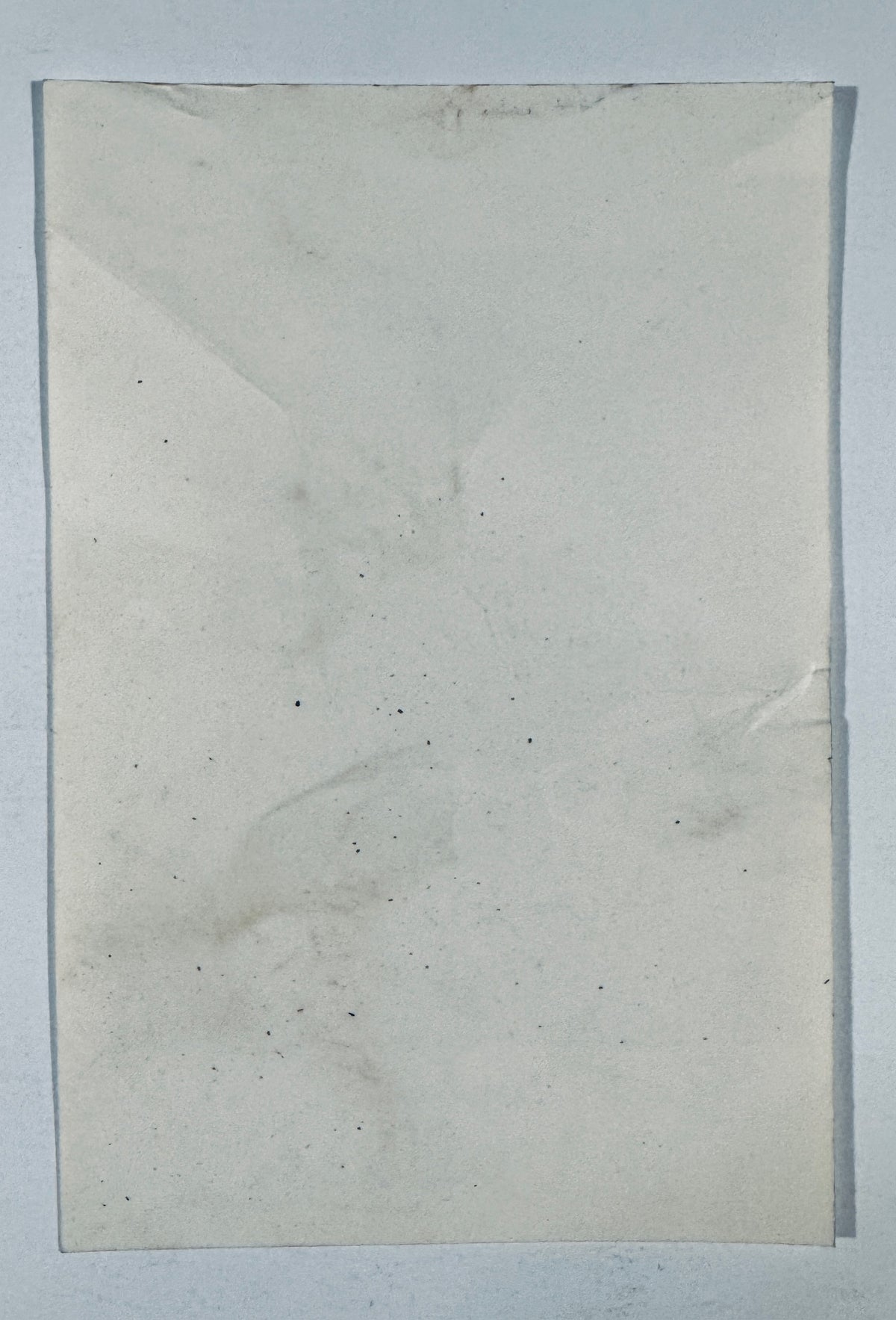 Reverse back view of vintage Eli Wallach signed photo showing paper condition and aging.