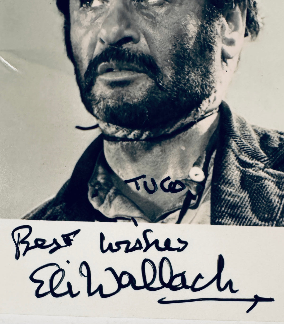 Close up detail of Eli Wallach autograph and Tuco character inscription in black ink.