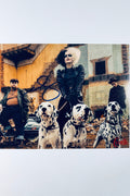Signed 8x10 matte promotional photo of actress Emma Stone as Cruella de Vil with her dalmatians and accomplices, featuring a bold blue ink autograph.