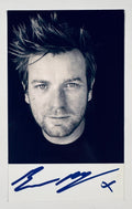 Full front view of black and white Ewan McGregor portrait photo hand-signed in blue marker.