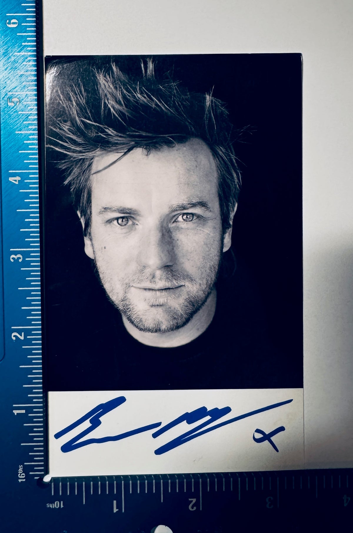 Full front view of signed Ewan McGregor photo with ruler showing 3.5x5.5 inch measurements.