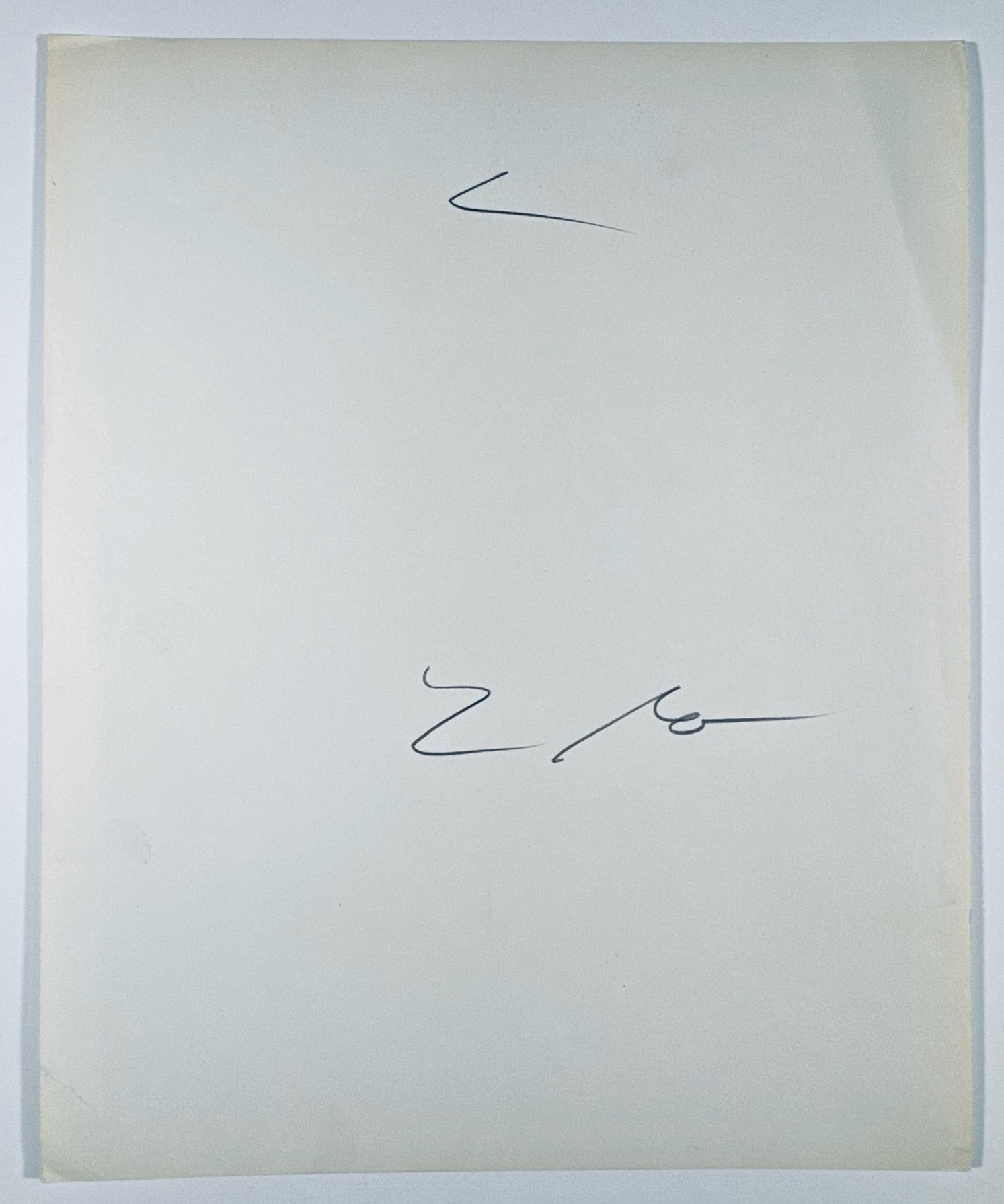 The back of the vintage 8x10 photograph showing its paper quality and overall condition.