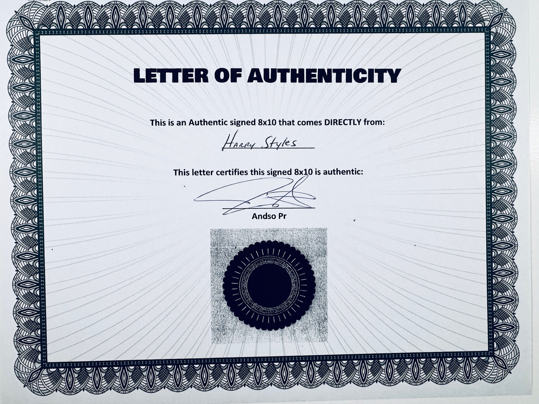 A Letter of Authenticity with a decorative blue-patterned border, certifying an authentic signed 8x10 coming directly from Harry Styles, featuring a dark circular seal graphic at the bottom.