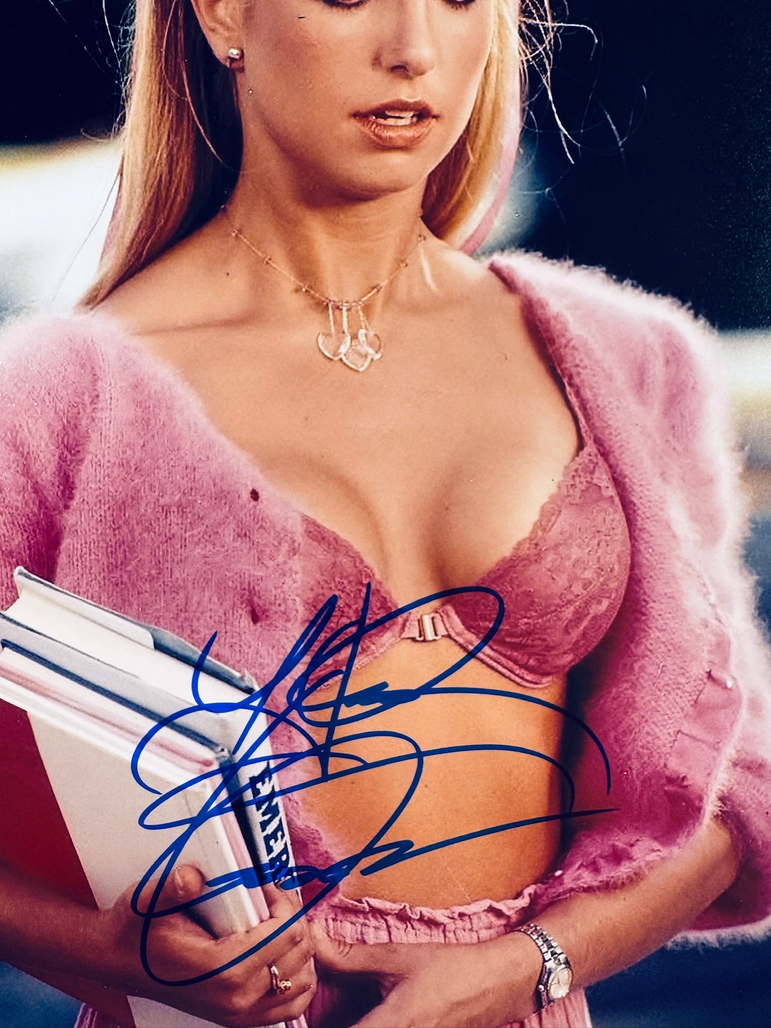 Close-up view of Heather Thomas's signature in blue marker across the Zapped! promotional photo.