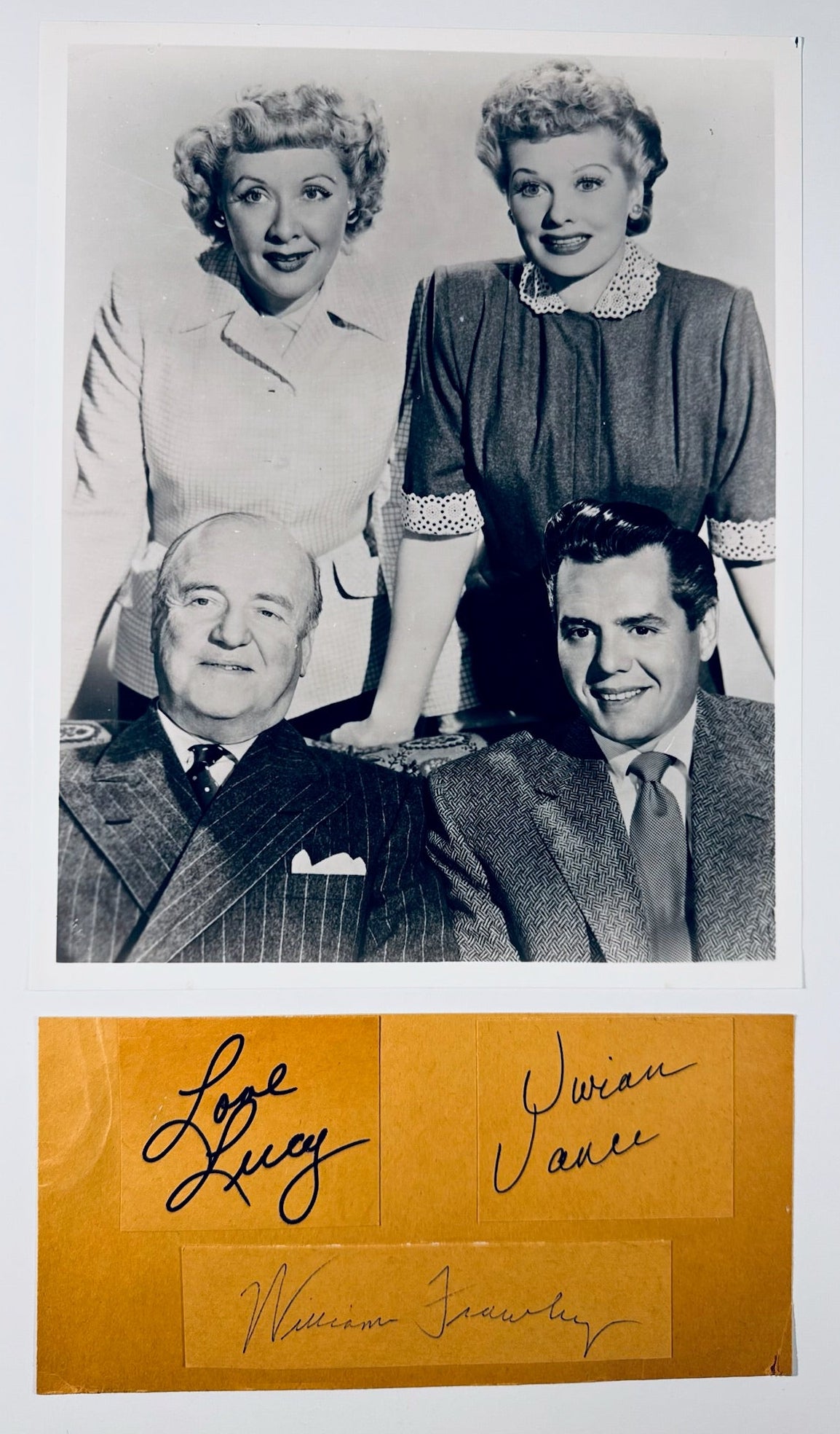 A collector's set including a vintage 8x10 cast photograph and a 7.5x3.75 vintage paper piece with three cast autographs.