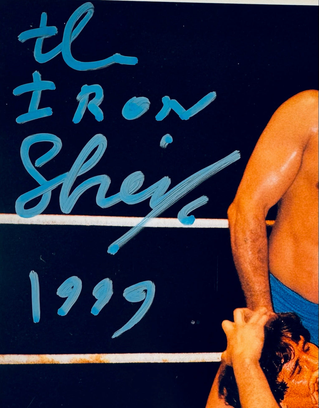 Closeup of The Iron Sheik autograph on WWF legend signed 8x10 photo