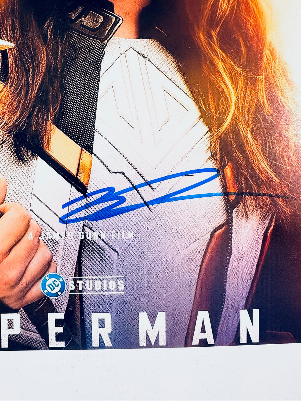 Close-up view of Isabela Merced's signature across the front of the Superman promotional photograph.