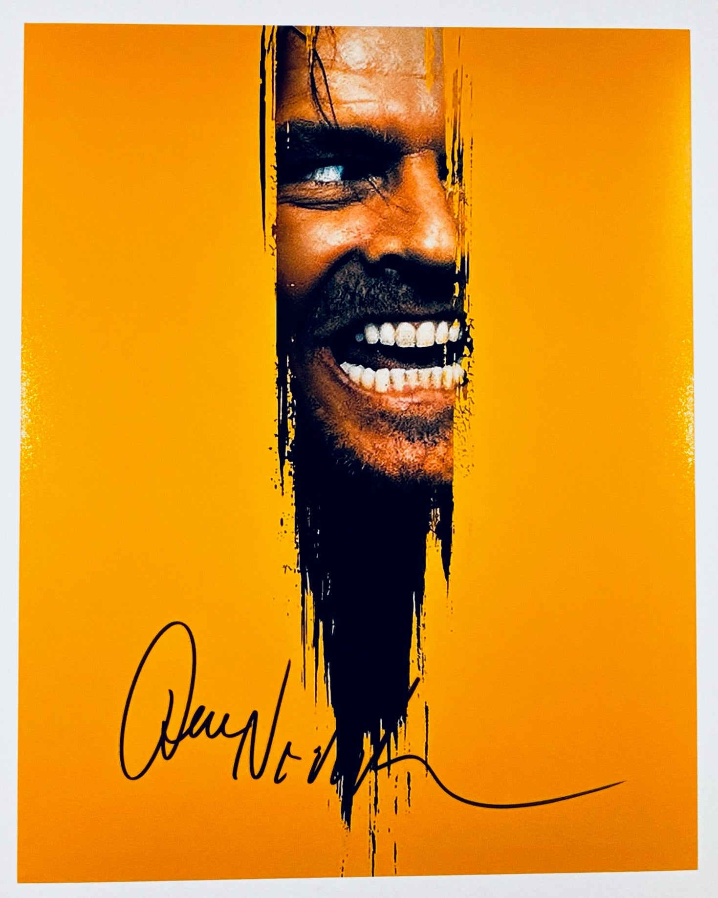 A professional 8x10 matte photograph featuring an authentic autograph by film legend Jack Nicholson.