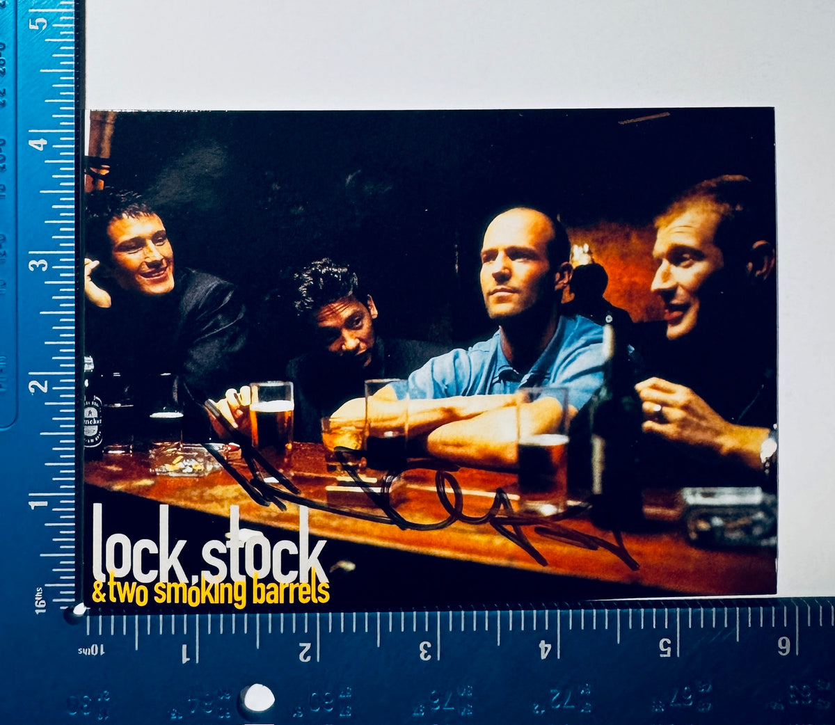 Jason Flemyng autographed movie postcard next to a ruler measuring approximately 4 by 6 inches.