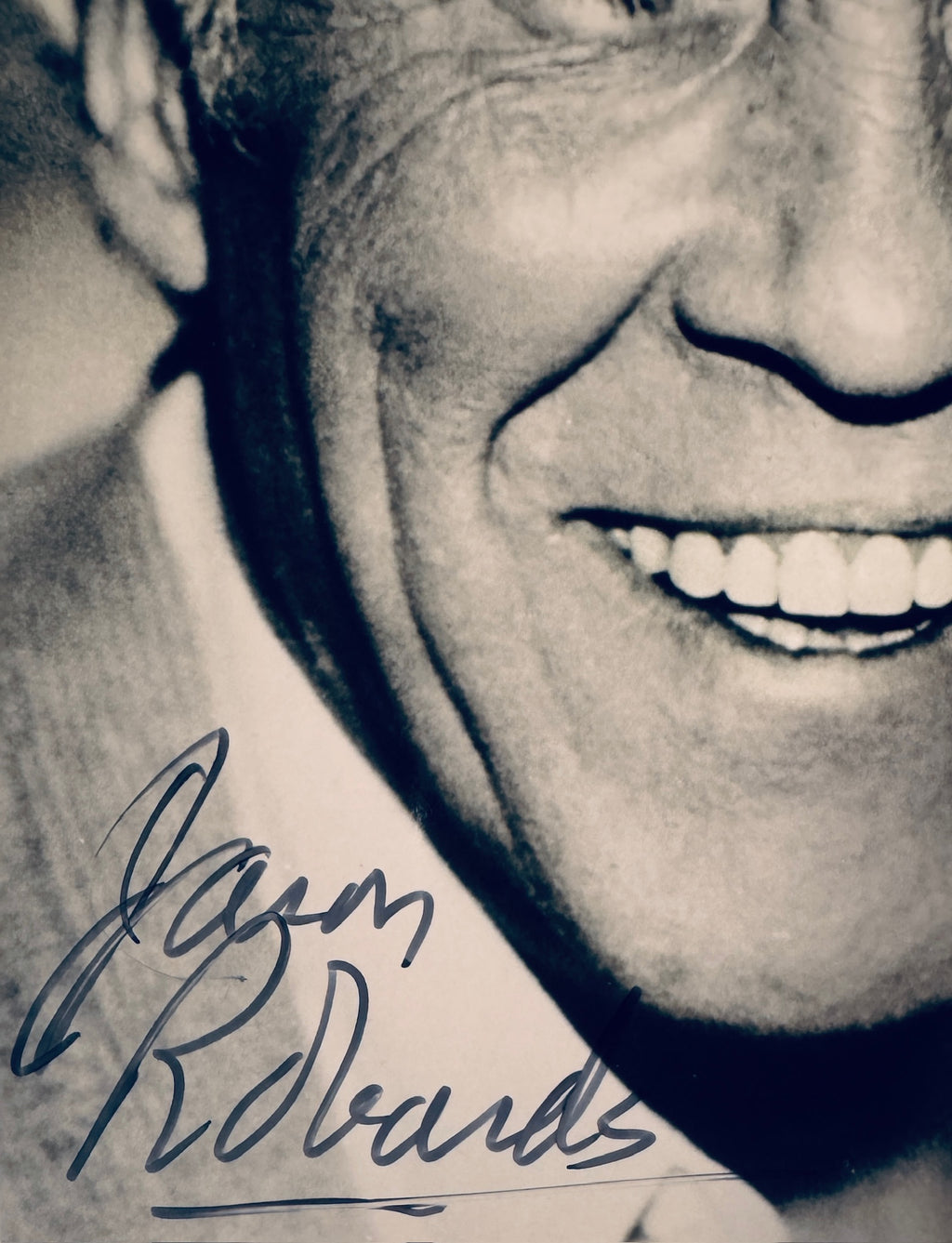 Close up view of authentic Jason Robards signature in blue ink on vintage photograph.