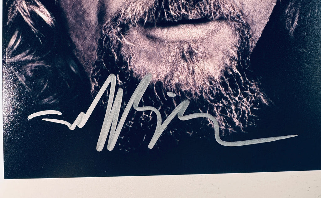 Close-up of Jeff Bridges's signature in silver marker on the signed The Big Lebowski 8x10 photo.