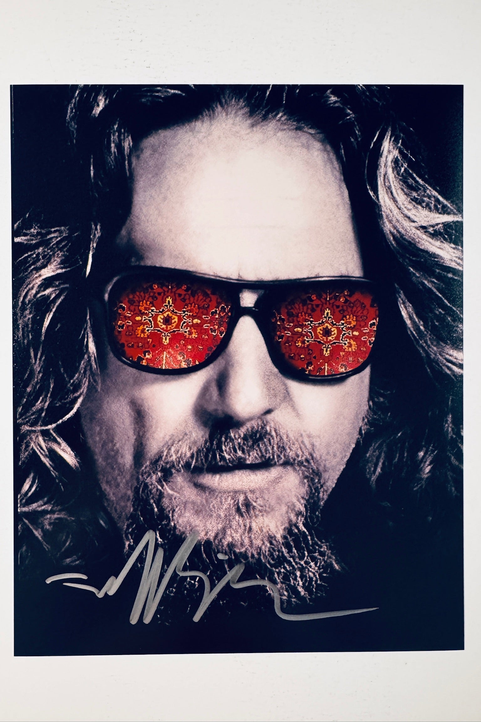 Jeff Bridges hand-signed 8x10 matte photo featuring The Dude from The Big Lebowski with a Persian rug pattern reflected in his sunglasses.