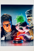 Signed 8x10 matte promotional photo of comedian Jeff Dunham with puppet characters from Crank Yankers looking at a red button, featuring a bold silver ink autograph.